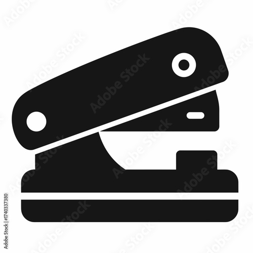 A simple black icon of a desktop hole puncher used for office work and stationery.