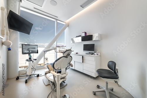 Modern dental office interior with reception desk, patient chairs, treatment rooms and professional equipment. Bright clean environment designed for healthcare and dentistry services, including x-ray 