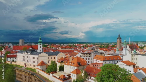 Wallpaper Mural An aerial drone shot showcasing the picturesque old town of České Budějovice, Czech Republic, featuring its historic architecture, vibrant rooftops, and the tranquil Vltava River flowing through the c Torontodigital.ca