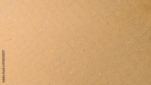 Old Kraft paper texture box craft stripes pattern. top view.
Abstract brown recycled paper background. 