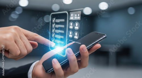 A business person uses a smartphone to interact with a futuristic holographic checklist and user profiles.