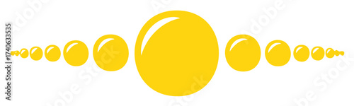 Symmetrical arrangement of glossy yellow spheres in graduating sizes creating a visual flow