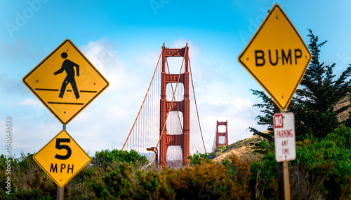Golden Gate Bridge behind yellow Road Signs