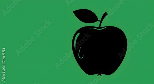 Black apple on green background minimalistic food graphic
