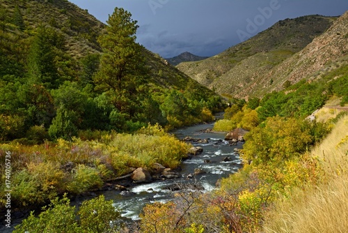 Beautiful early fall scene with a mountain backdrop  next to the south platte river  in  waterton canyon, littleton, colorado  