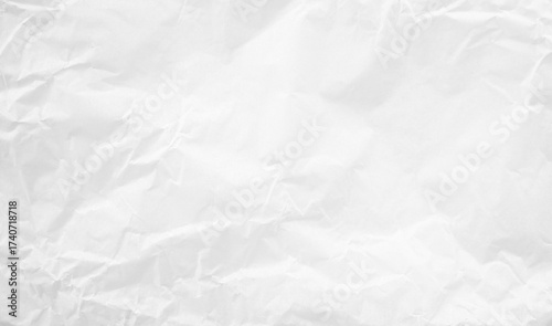 White wrinkled paper texture background. This crumpled paper surface is ideal for use as a backdrop or abstract texture in branding