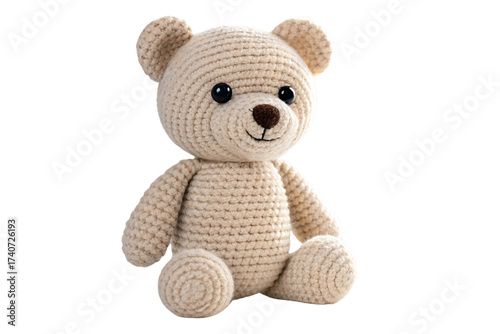 Soft beige crocheted sitting teddy bear with plump body, round limbs, and cheerful embroidered facial expression, isolated on a transparent background