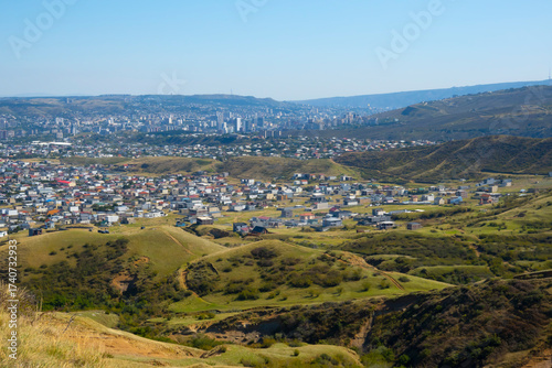 A view from a nearby mountain of the Didi-Digomi district in Tbilisi, Georgia, on a sunny day