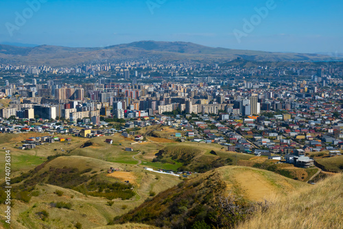 A view from a nearby mountain of the Didi-Digomi district in Tbilisi, Georgia, on a sunny day