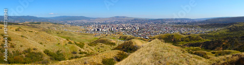 Panoramic view from a nearby mountain of the Didi-Digomi district in Tbilisi, Georgia, on a sunny day