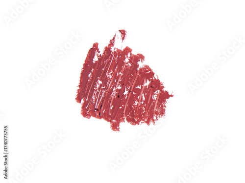 Rich terracotta lipstick swatch, beauty product texture dark background.