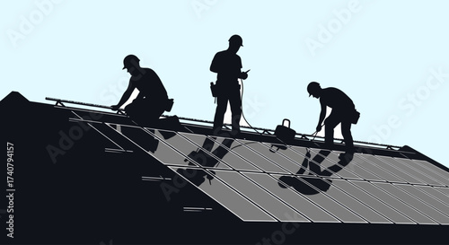 Silhouette of construction workers installing solar panels on rooftop against clear sky