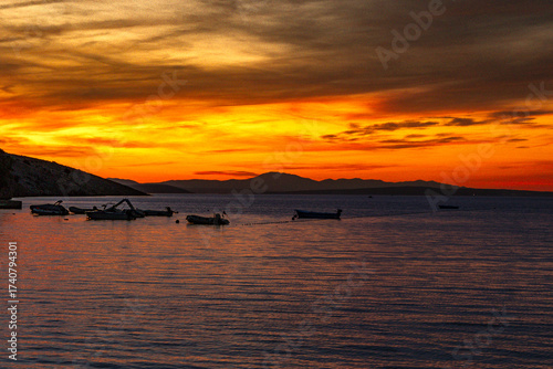 Fototapeta Naklejka Na Ścianę i Meble -  Sunset over the island and city of Rab in the Adriatic sea, Croatia
