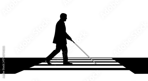Silhouette of blind man crossing street with cane