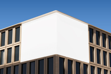 Blank white billboard mockup on modern building corner facade under clear blue sky for outdoor advertising and poster design concept display. 3D Rendering