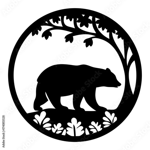 Silhouette of a bear walking under a tree within a circular frame