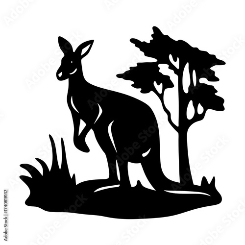 Black and white silhouette of a kangaroo standing near a tree