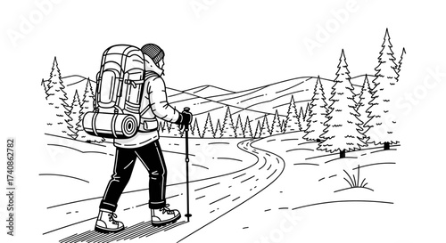 Backpacker hiking on snowy trail, exploring winter wilderness