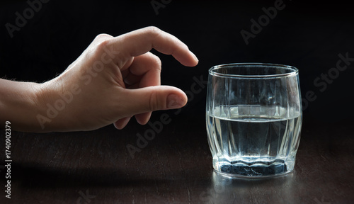 Tableau sur toile An optimist and a pessimist's opinion about a glass of water
