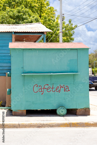 Pedernales, Dominican Republic, 8 august 2025. Typical Dominican cafeteria food truck made of wood, painted a bright green color.