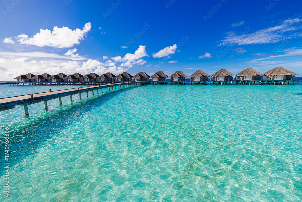 Fototapeta premium Panoramic landscape of Maldives beach. Tropical sunny panorama, luxury water villa sea sky. Resort wooden pier jetty. Luxury popular travel destination background summer holiday. Best vacation tourism
