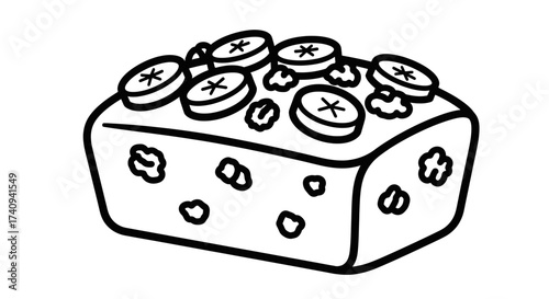 Delicious banana bread with walnuts and banana slices on top.