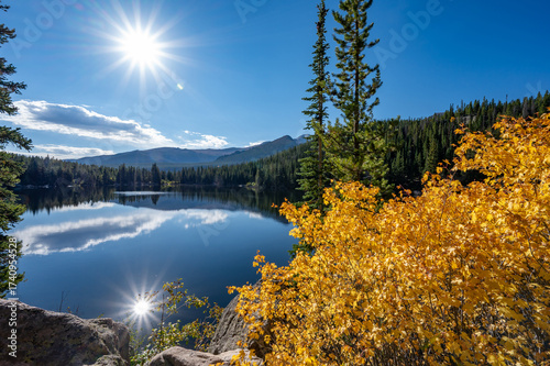 Photos Sun shining on Bear Lake, a scenic trailhead and destination in Rocky Mountain National Park, Colorado, USA