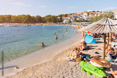 Fototapeta Naklejka Na Ścianę i Meble -  Primosten beach in Croatia with people enjoying summer activities