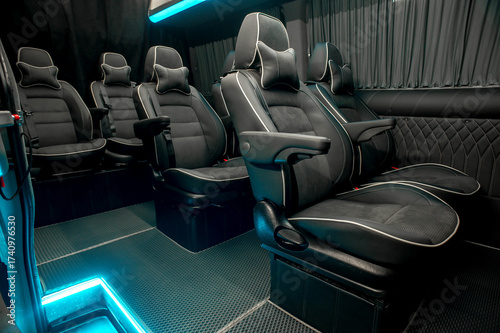Comfortable interior of a passenger bus with soft seats
