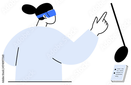 Person wearing VR headset pointing at virtual elements, microphone and notebook nearby. Ideal for innovation, technology, education, virtual tools, creativity, communication immersive experience. A