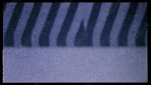 close-up of the screen texture of an old VHS video tape file, with a blue color dot background and a grainy film effect. Photo overlay via blend mode or half dot print layer.