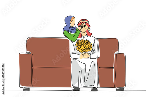 Single continuous line drawing an arab man sitting on the sofa holding a bouquet of flowers. A surprise from his beloved wife. Complete each other. Love. Surprise. One line design vector illustration