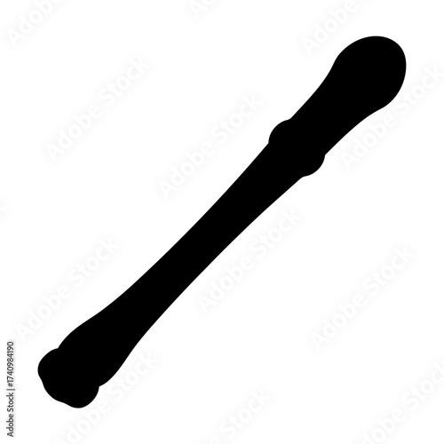 Isolated black silhouette of a long bone against a white background space