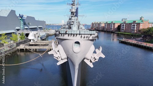 Wallpaper Mural The historic Wisconsin BB-64 battleship sits docked at the Norfolk harbor, featuring multiple gun turrets, radar towers, and a towering superstructure, conveying power, defense, and maritime strength Torontodigital.ca