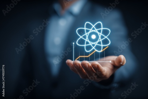 Professional man presenting an atomic model with growth graph in a modern business setting