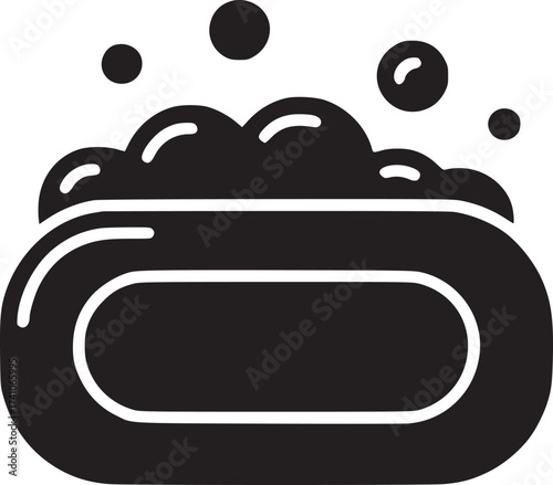 A black and white icon of a bar of soap with bubbles floating above it on a light background