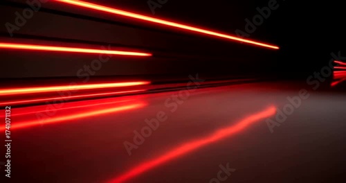Dynamic red light streaks reflecting on a smooth surface in a dark setting