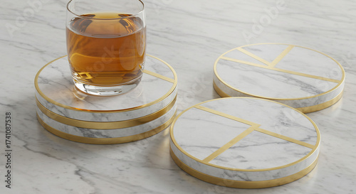 Luxurious home decor concept featuring a set of modern white marble and gold coasters with a glass of whiskey for elegant entertaining