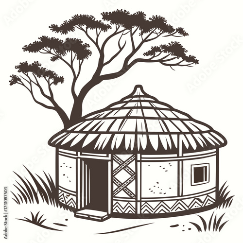 Traditional African round hut with thatched roof and acacia tree