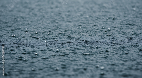 Rainfall Over Dark Water Capturing the Beauty of a Rainy Day Landscape With Close-Up Shot of Water and Splashes