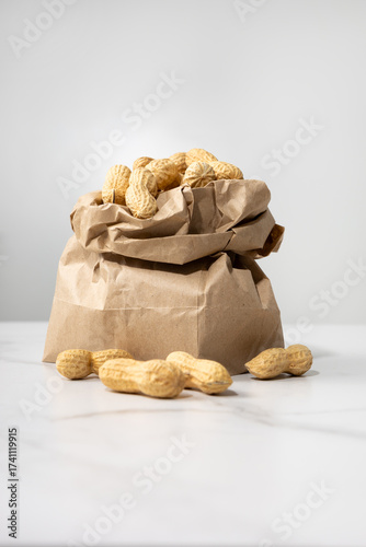Close up of peanuts in paper shopping bag