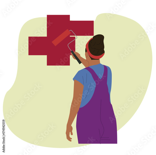 woman paints with a roll brush.Young woman painting wall 
