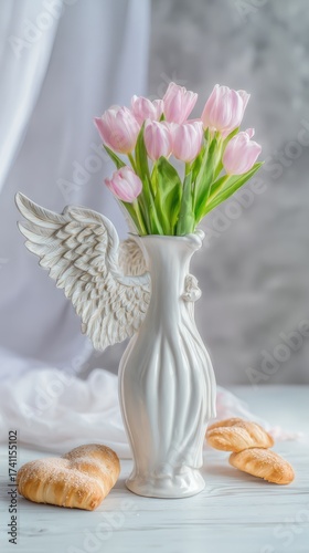 A vase of pink tulips on the table