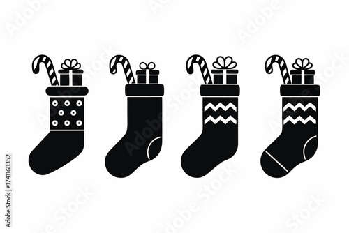set of Christmas stocking filled with gifts and candy canes icon, vector illustration