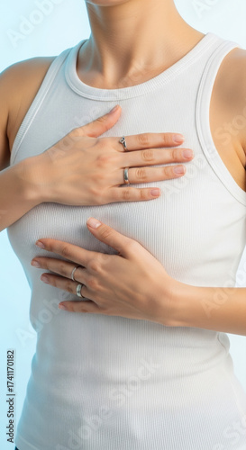 Wallpaper Mural Woman's hands check her breasts. A portrait emphasizing awareness and care. Breast cancer awareness, self-examination, early detection. World Breast Cancer Day Torontodigital.ca