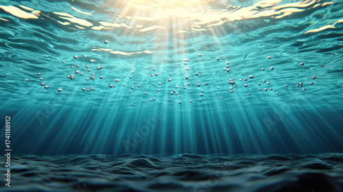 Bubbles rise through clear blue water, illuminated by sunlight filtering from above, creating mesmerizing underwater scene