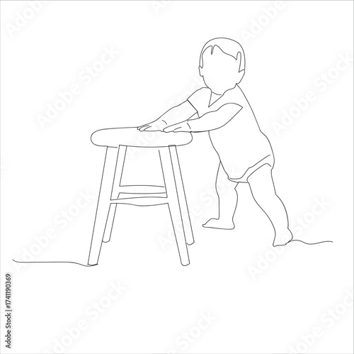 child learns to stand holding a chair.Baby on chair pulling himself, 