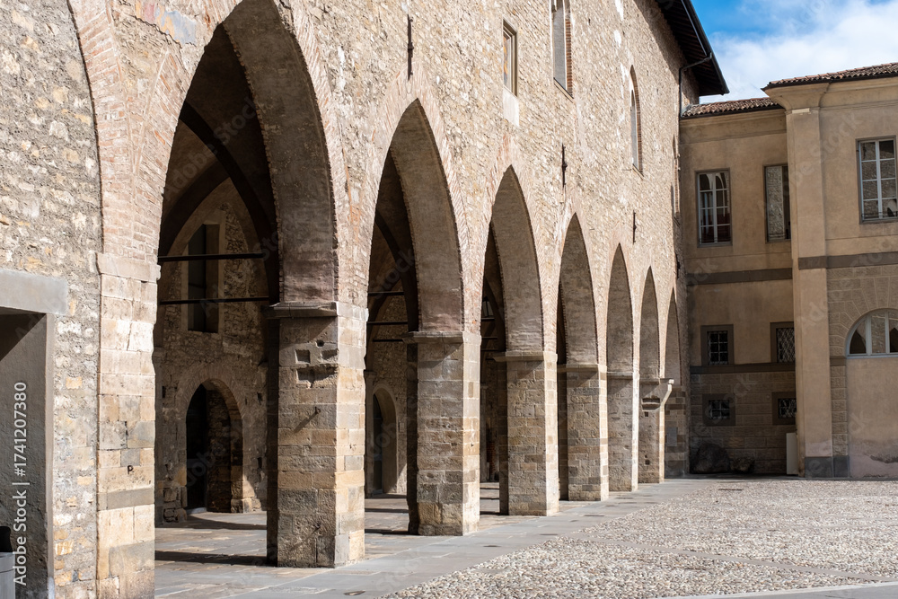 Naklejka premium Tourists destination, historical part of Bergamo city, Bergamo Alta with narrow streets, churces, old houses, located on hill with fortress walls, Lombardy, Northern Italy