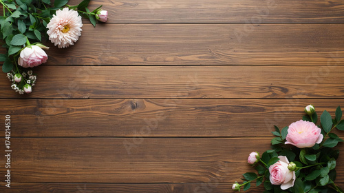 Rustic Wooden Table Top with Soft Pink Flowers and Green Leaves in Corners for Background or Product Display