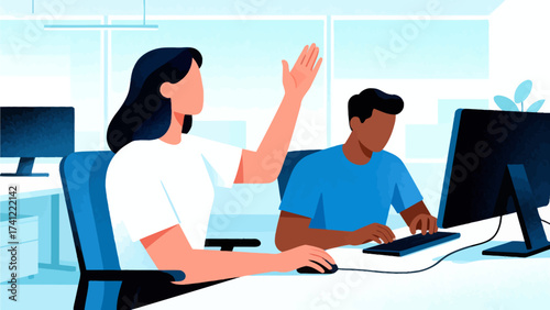 Two people working at computers in office